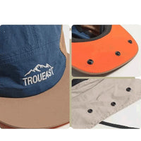 Close-up do tecido e logo de montanha, detalhando a proteção de nuca e o design exclusivo do boné de Alto Valor.